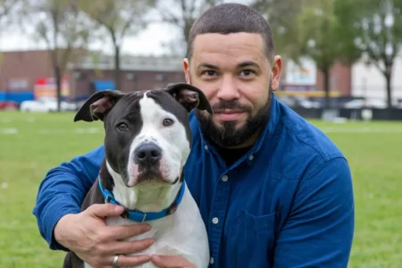 Paws Of Purpose - Dog Pet Adoption - Picture Of A Man Hugging A Dog - PawsOfPurpose.com